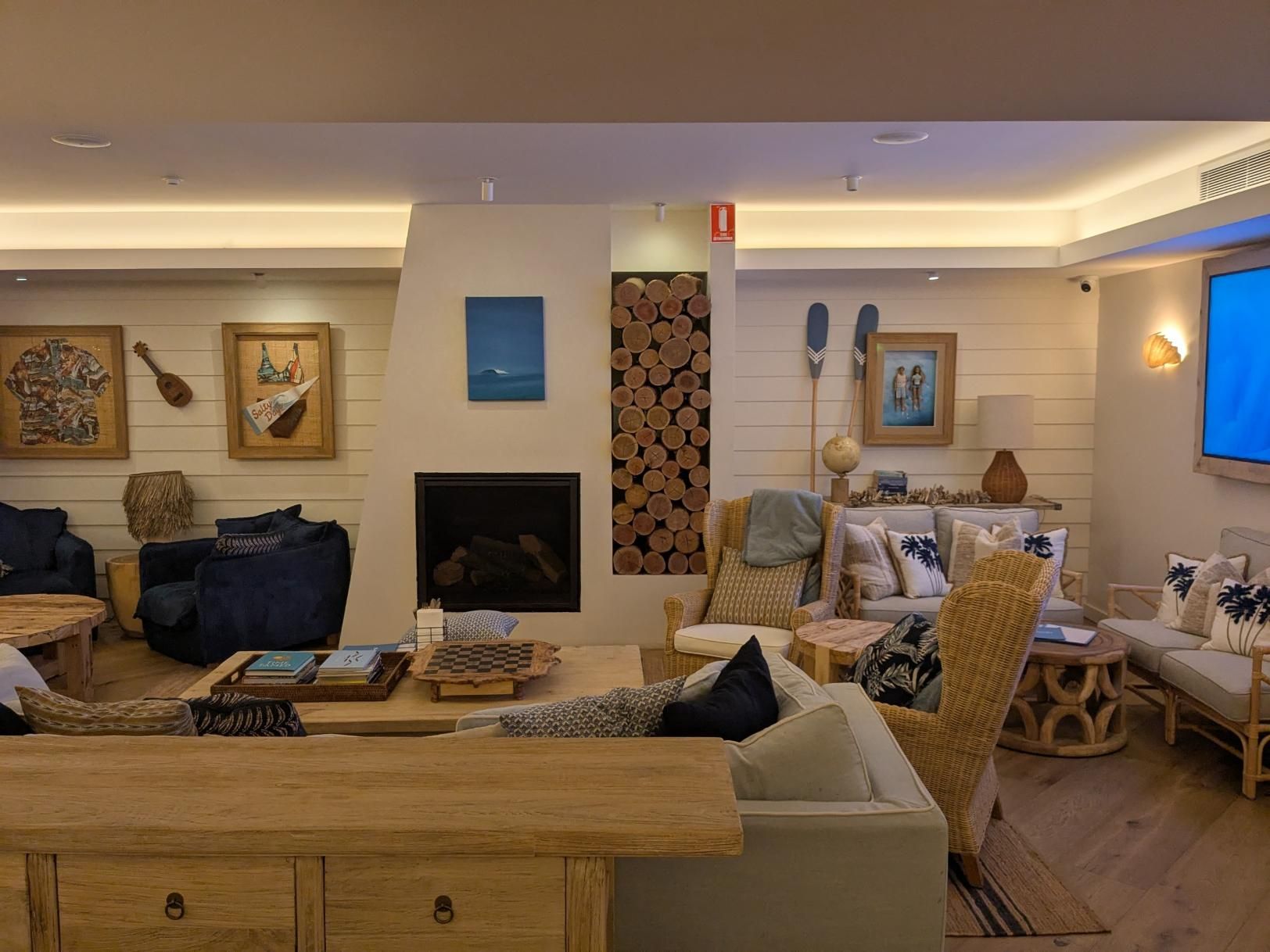 A Living Room Filled With Furniture and a Fireplace — BK Build Group in Sawtell, NSW