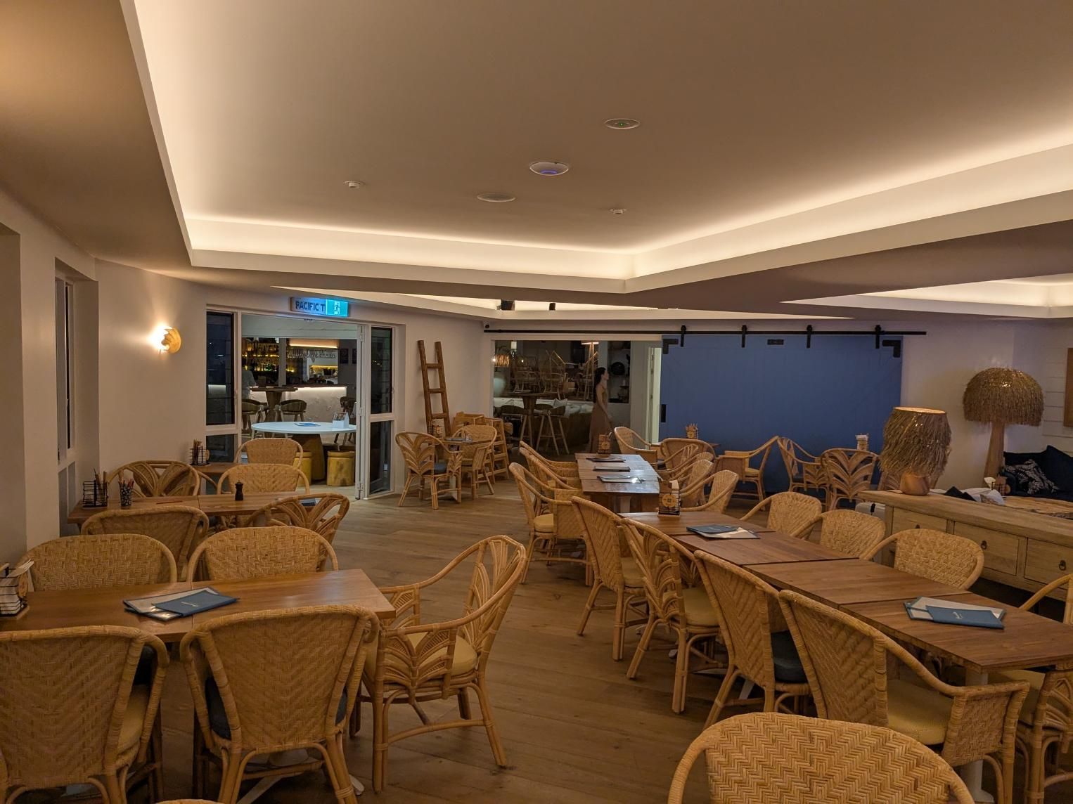 A Large Room Filled With Tables and Chairs in a Restaurant — BK Build Group in Bellingen, NSW