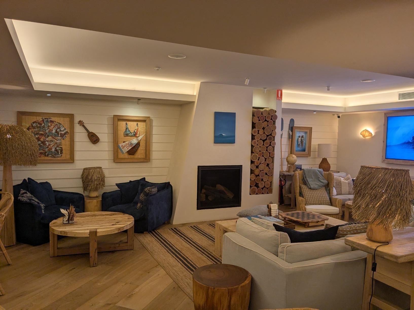 A Living Room Filled With Furniture and a Fireplace — BK Build Group in Coffs Harbour, NSW