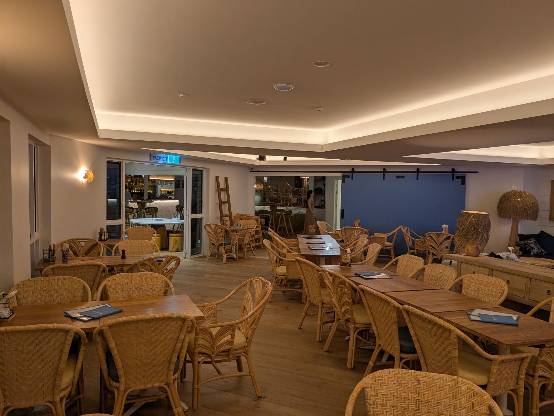 A Large Room With Tables and Chairs in It — BK Build Group in Coffs Harbour, NSW