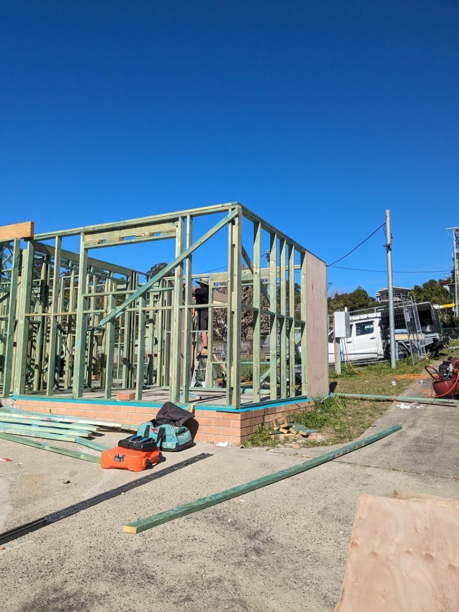 A House is Being Built on a Sunny Day With a Blue Sky in the Background — BK Build Group in Bellingen, NSW