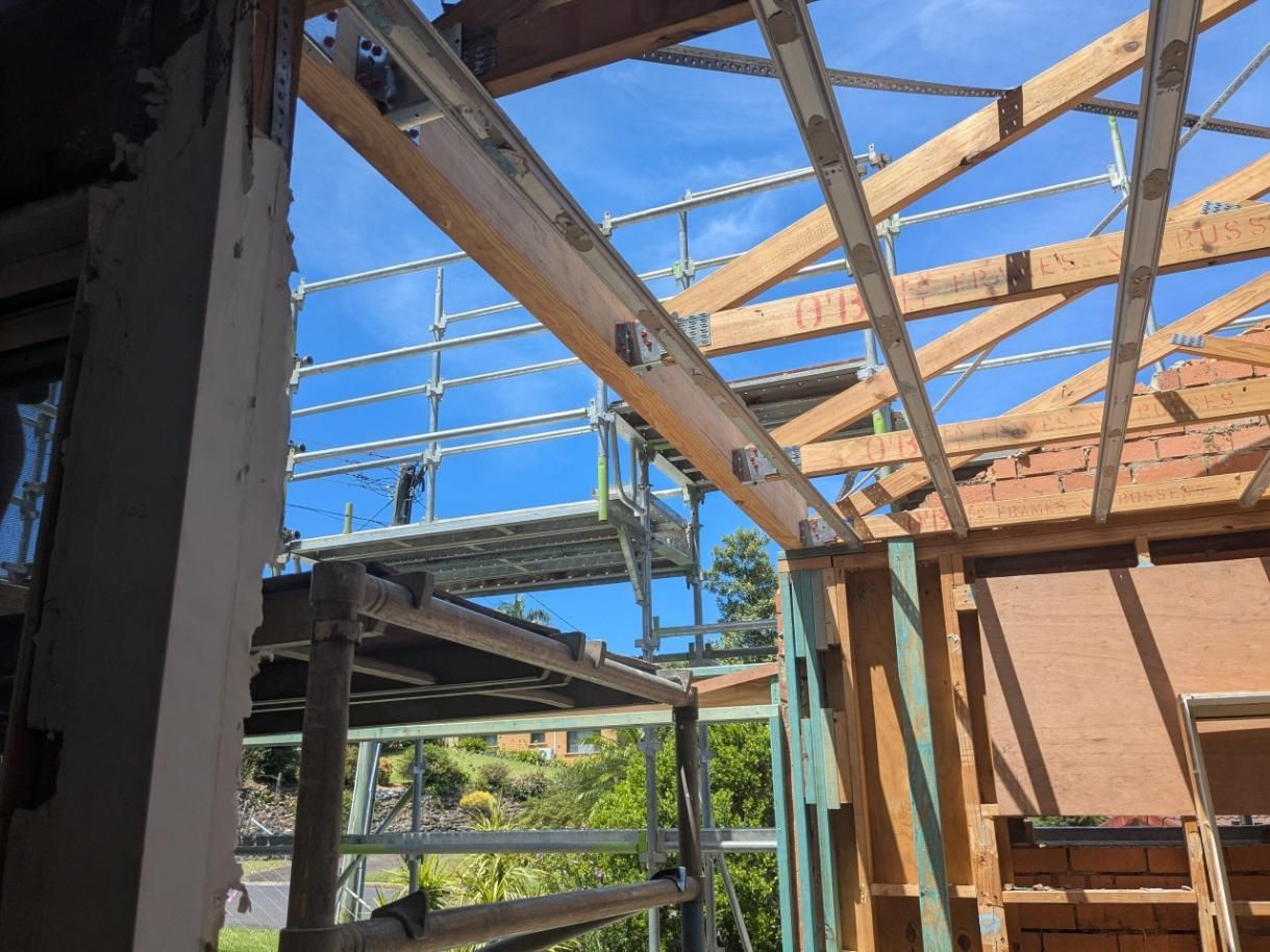 A Building Under Construction With Scaffolding and a Blue Sky in the Background — BK Build Group in Sawtell, NSW