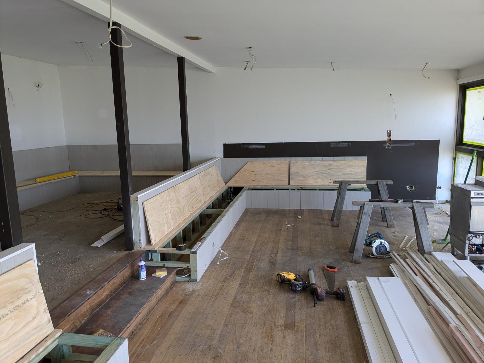 A Room With Wooden Floors and a Bench Under Construction — BK Build Group in Bellingen, NSW