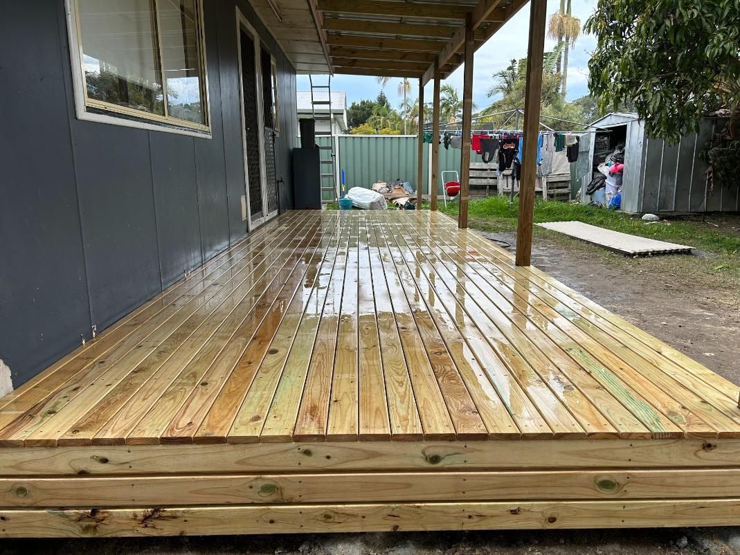 A Wooden Deck is Being Built in Front of a House — BK Build Group in Sawtell, NSW