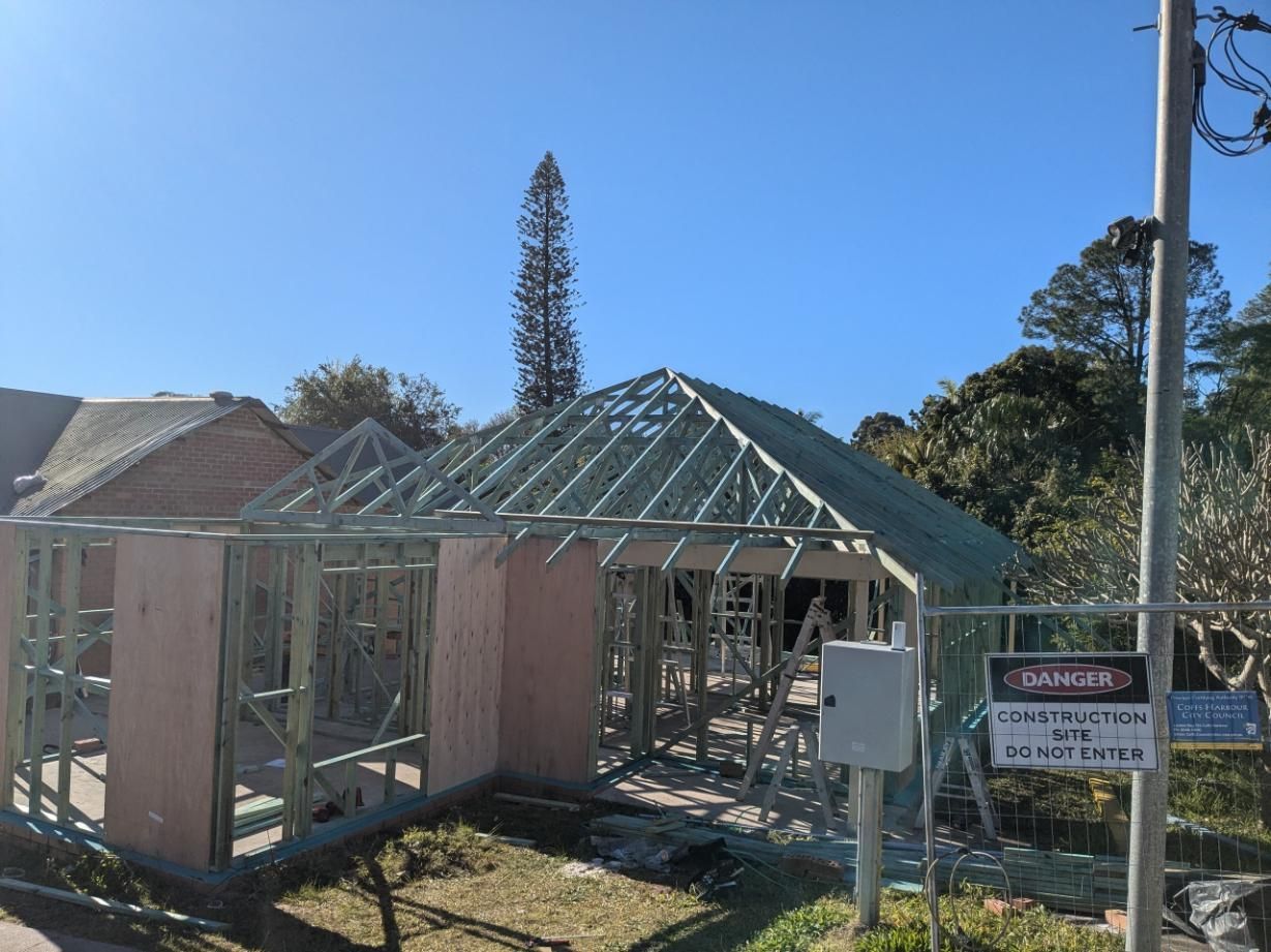 A House is Being Built With a Sign in Front of It — BK Build Group in Bellingen, NSW