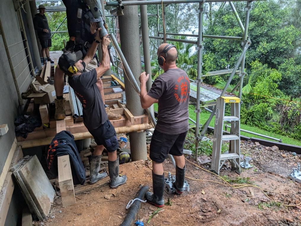 A Group of Men Are Working on a Scaffolding Structure — BK Build Group in Nambucca Heads, NSW