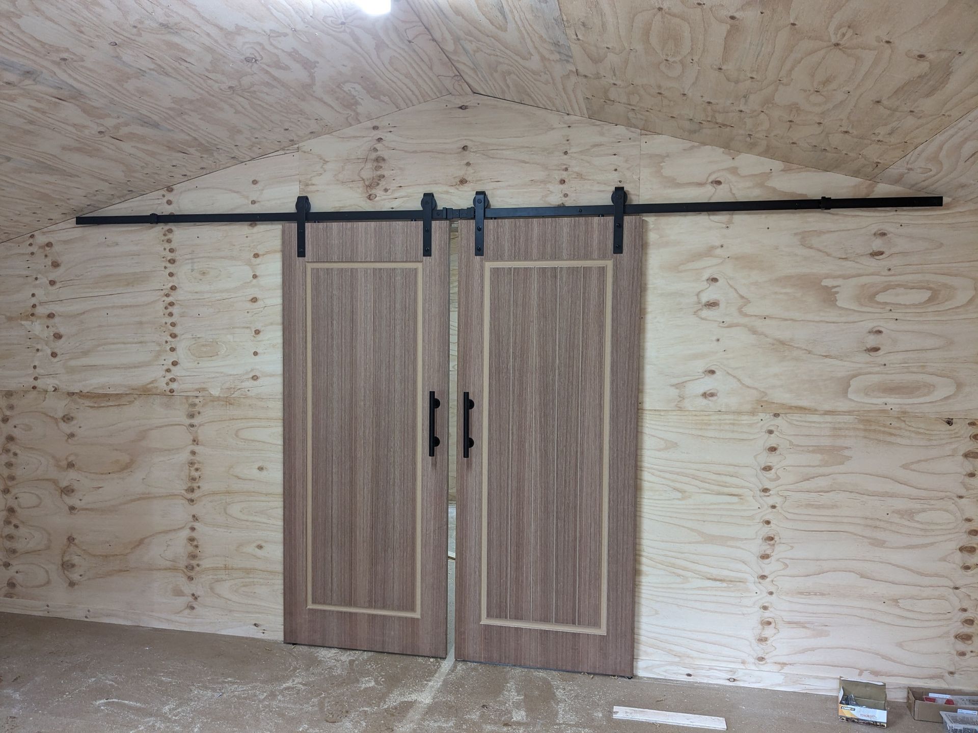 A Pair of Sliding Barn Doors in a Room — BK Build Group in Coffs Harbour, NSW