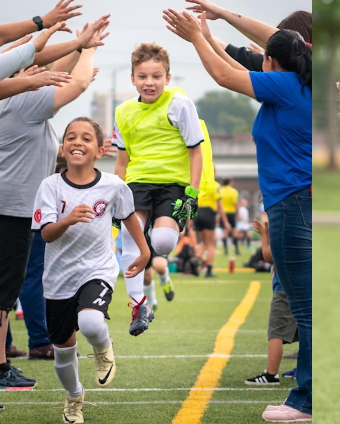 A group of children are playing soccer on a field