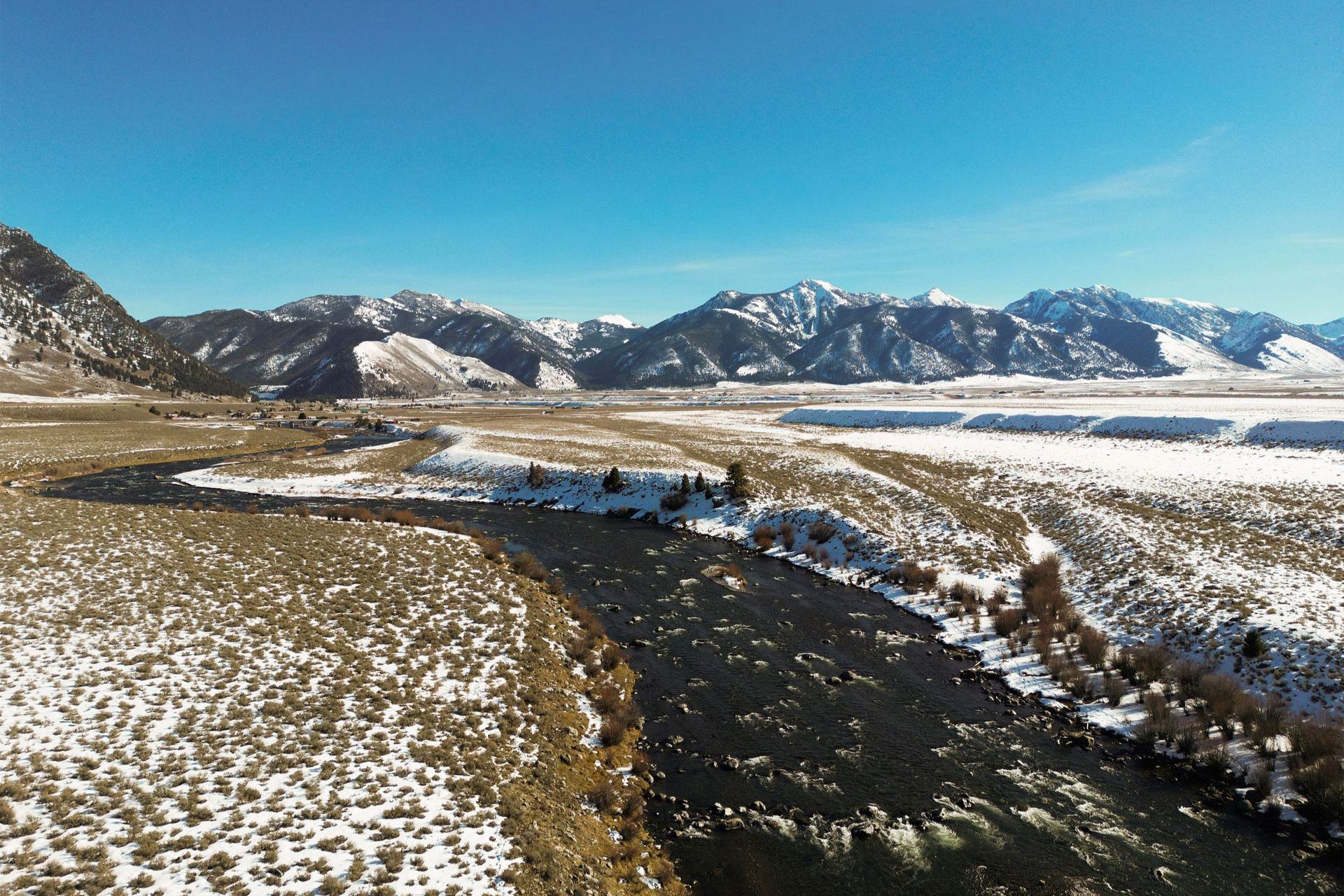 Madison River in the winter with snow covered banks