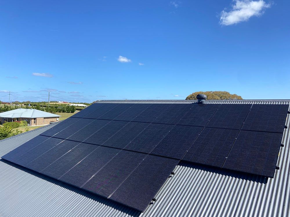 Clean Solar Panels On The Roof Of A House — Goulburn Solar In Goulburn, NSW