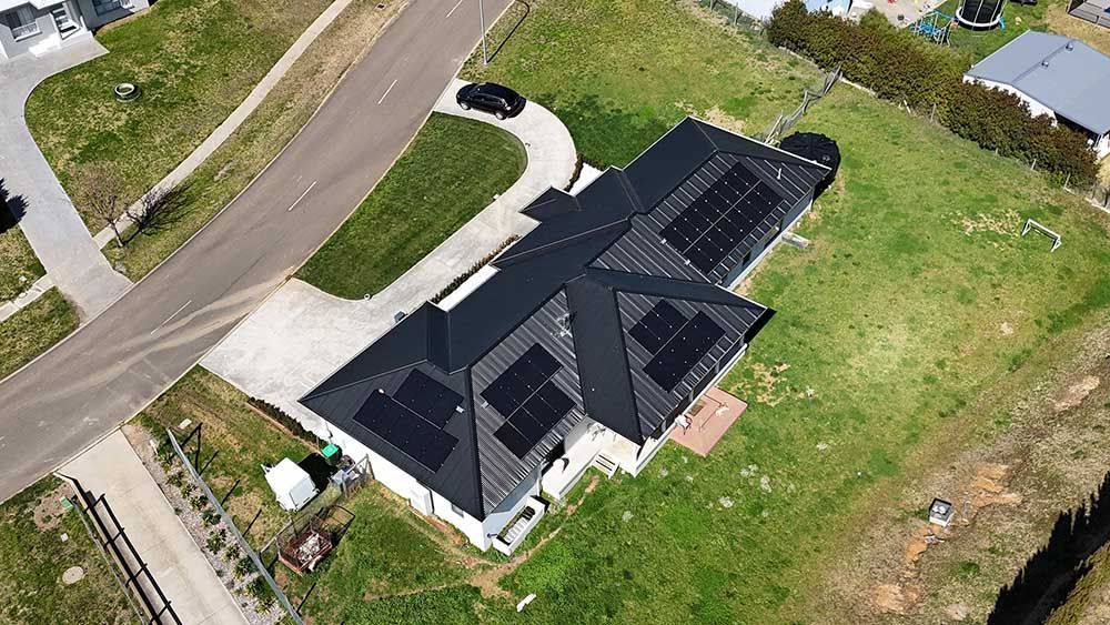An Aerial View Of A House With Solar Panels On The Roof — Goulburn Solar In Goulburn, NSW