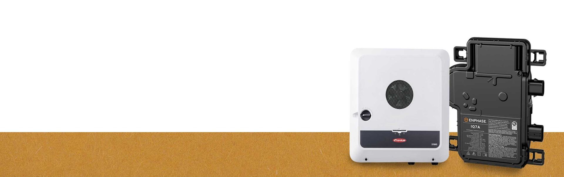 Inverters On Top Of A Brown Table — Goulburn Solar In Goulburn, NSW