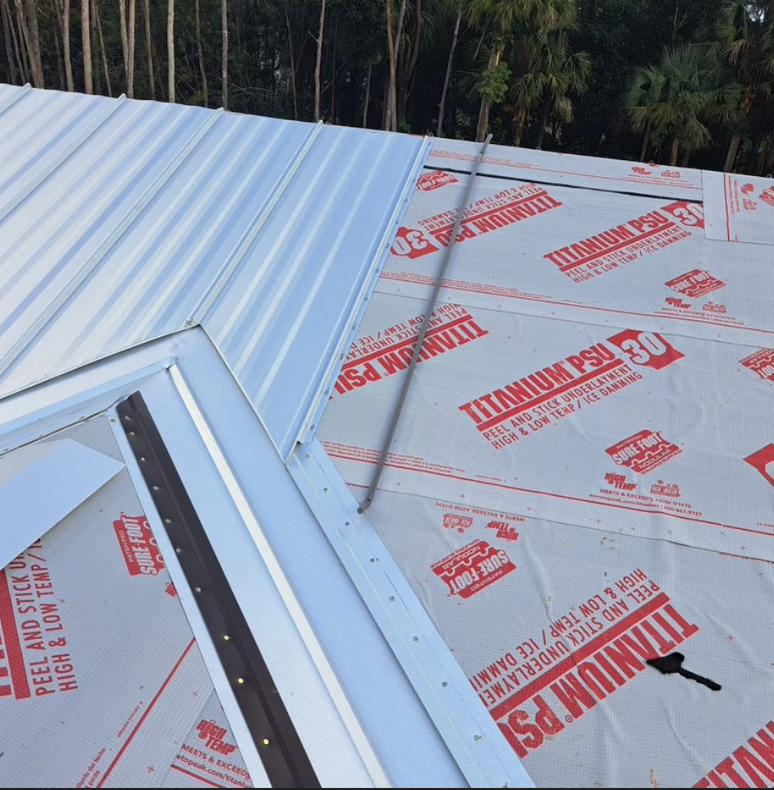 Metal roof installation with underlayment, flashing, and a label for high and low temperatures.