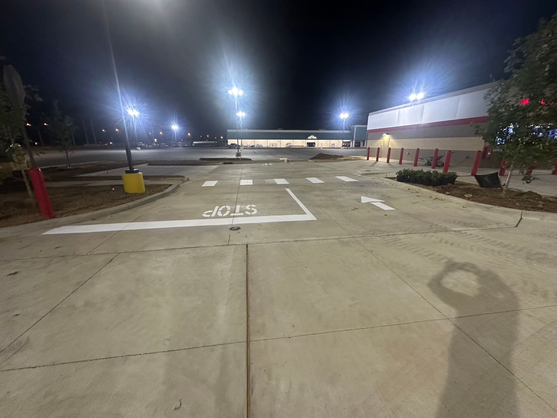 An empty parking lot at night with 