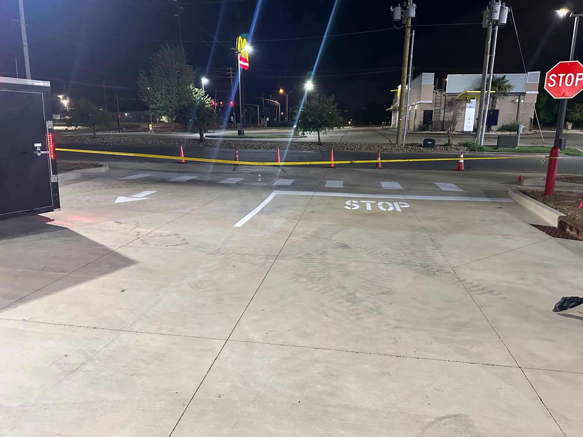 Concrete parking area with white lines and 