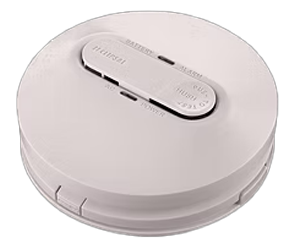 White smoke detector with a button labeled 