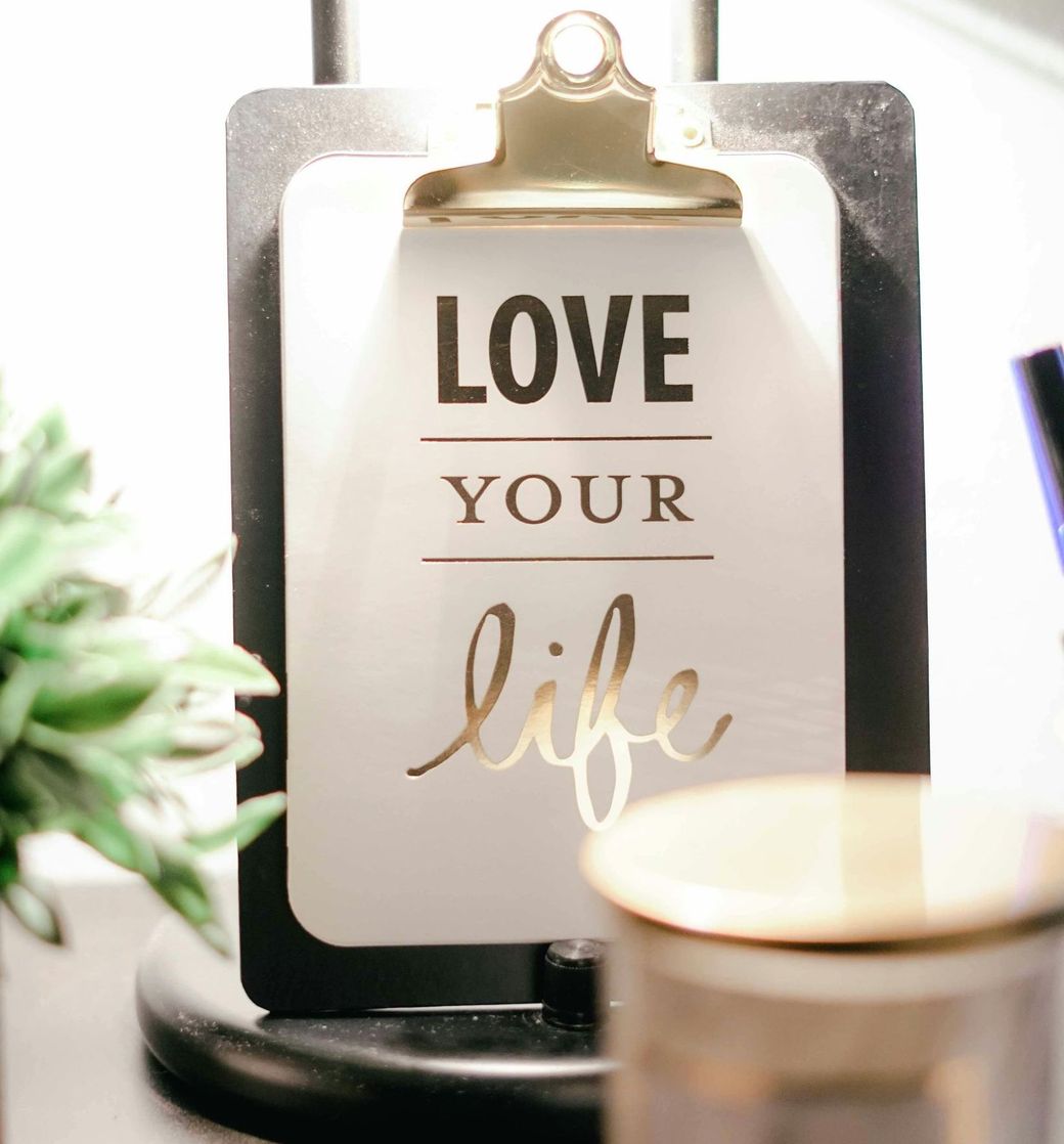 Black and white clipboard decor with the words