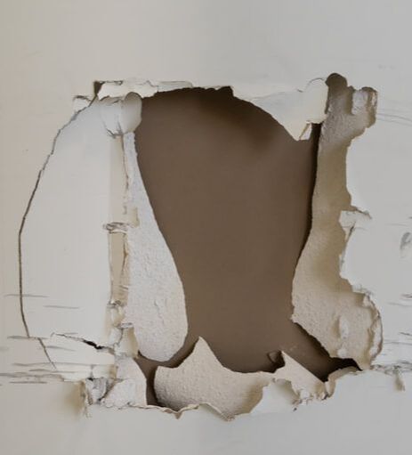 how to fix hole in drywall from door or kids
