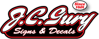 J.C. Guy Signs & Decals logo in red, white, and black with “Since 1949” badge