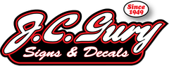 A logo for j.c. guy signs and decals