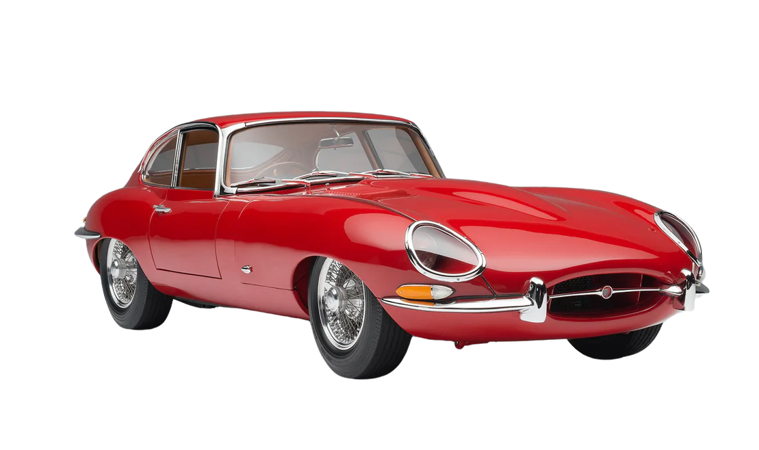 Red vintage sports car on a white background