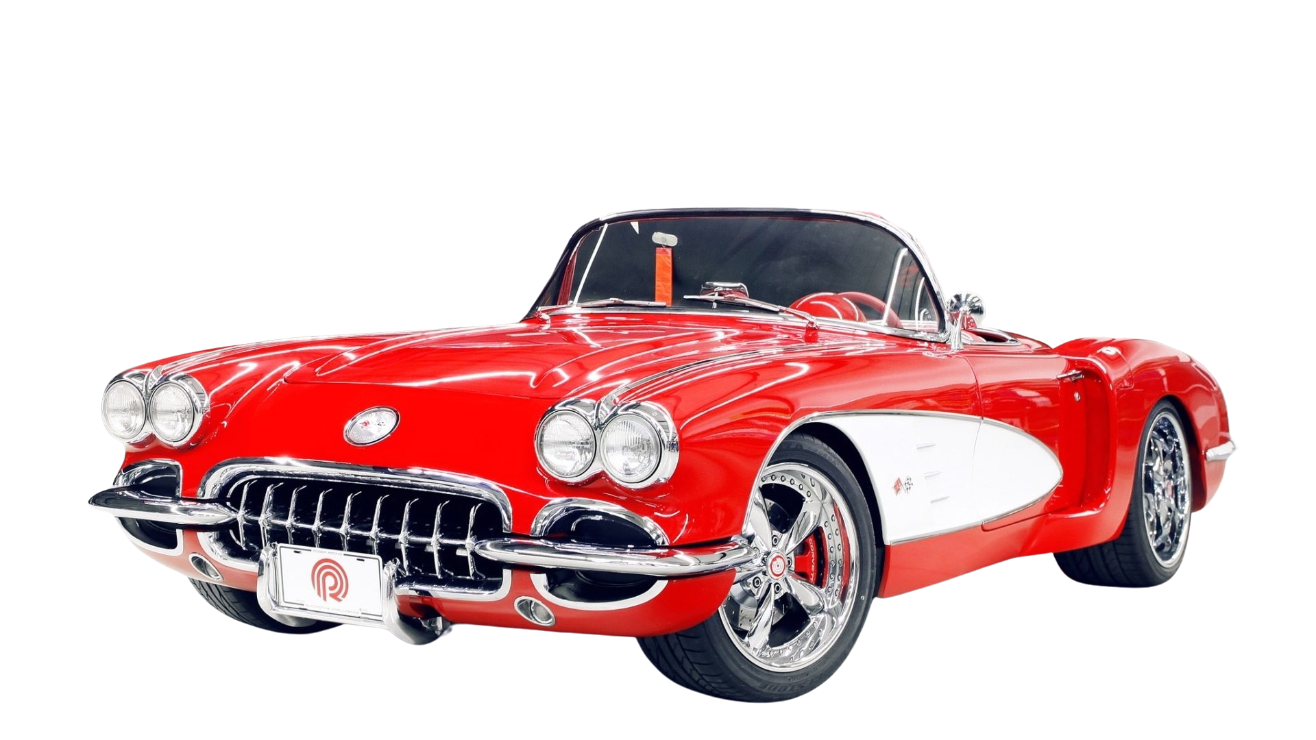 Red classic convertible sports car with chrome details on a white background