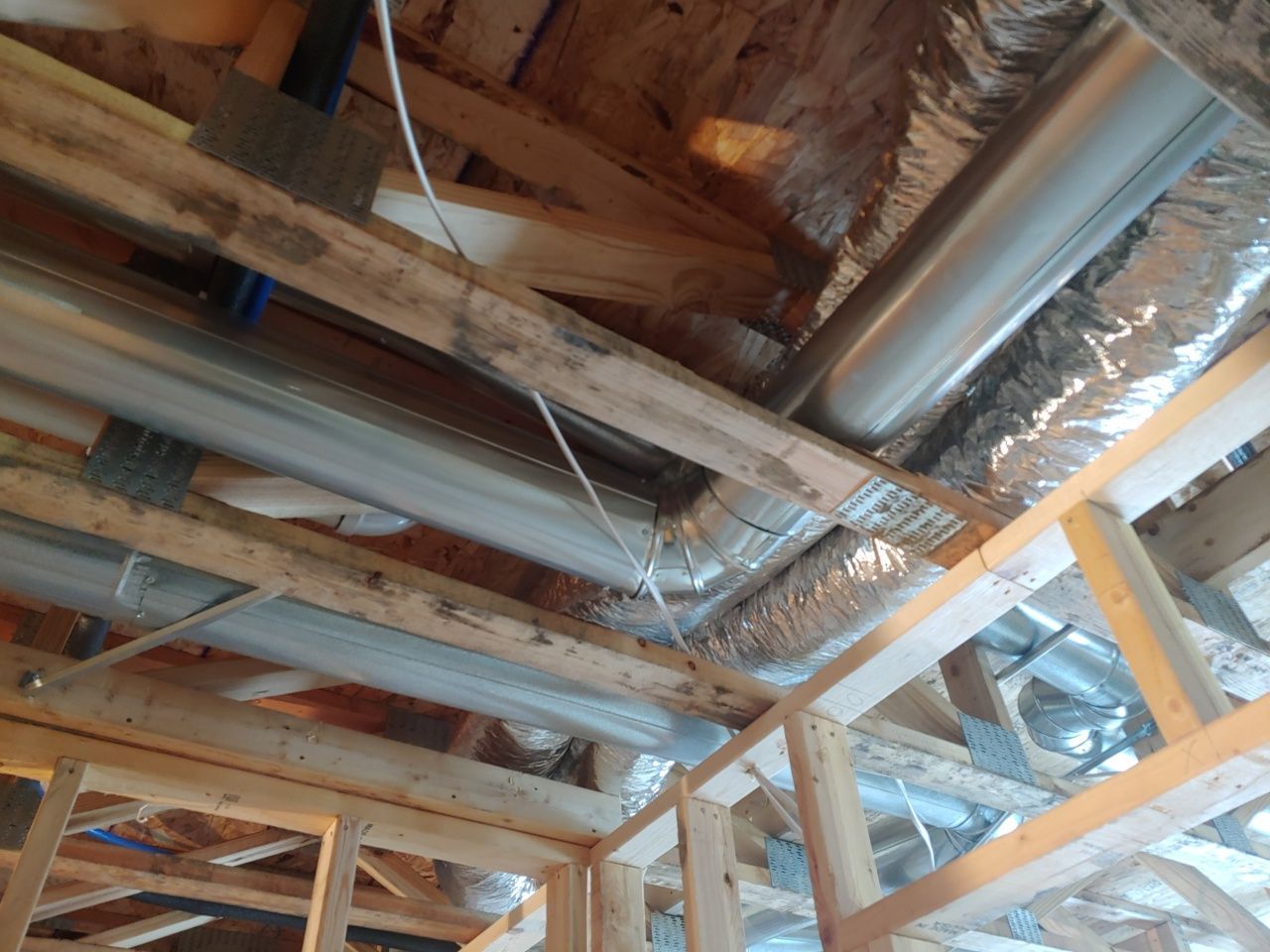 A room with a lot of pipes and wires coming out of it