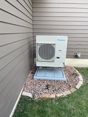 A picture of a heating system in a basement.