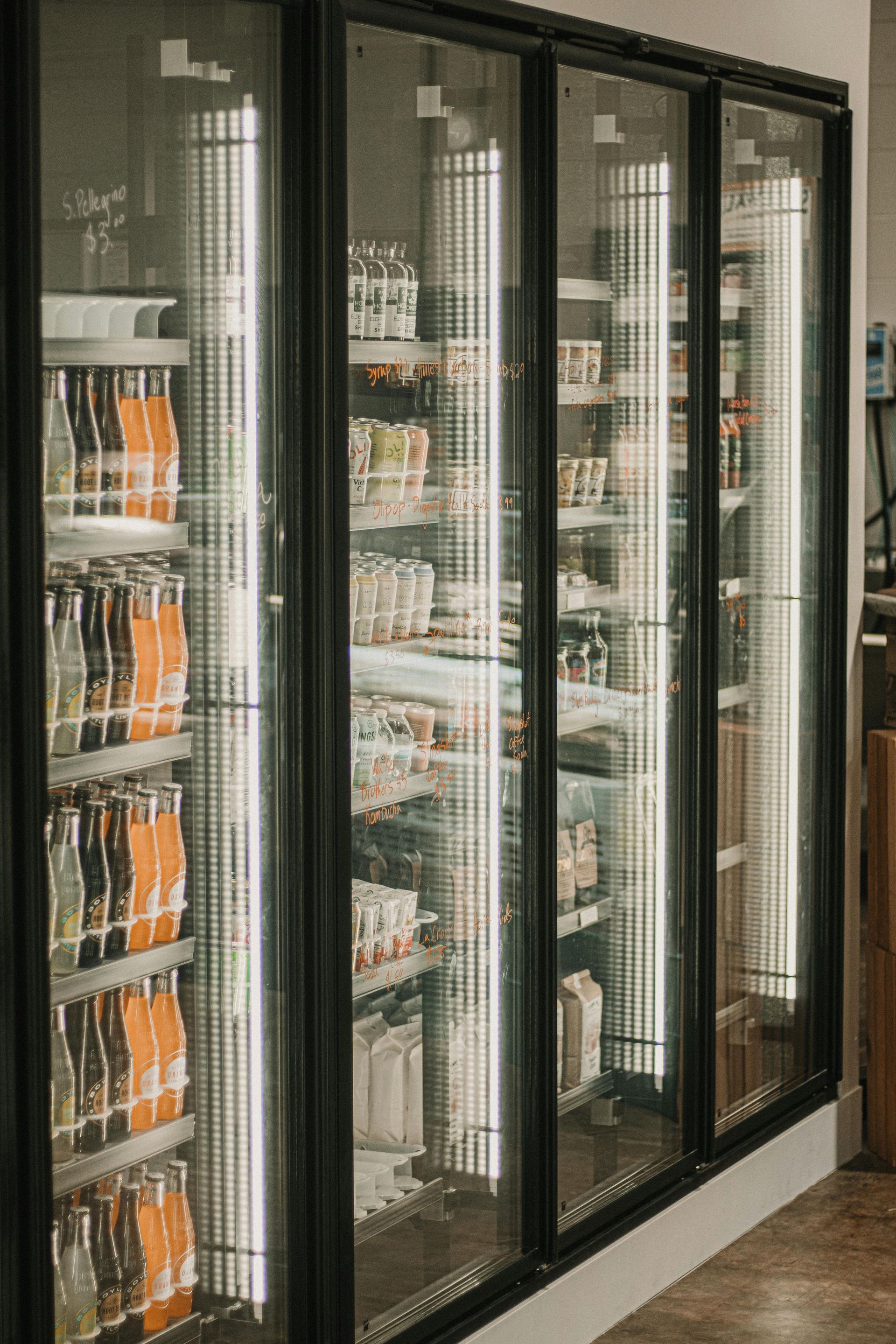 A male technician repairing a refrigerator