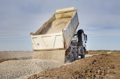 Truck Hauling and Dumping Gravel — Calvert County, MD — Middleton Backhoe Service LLC