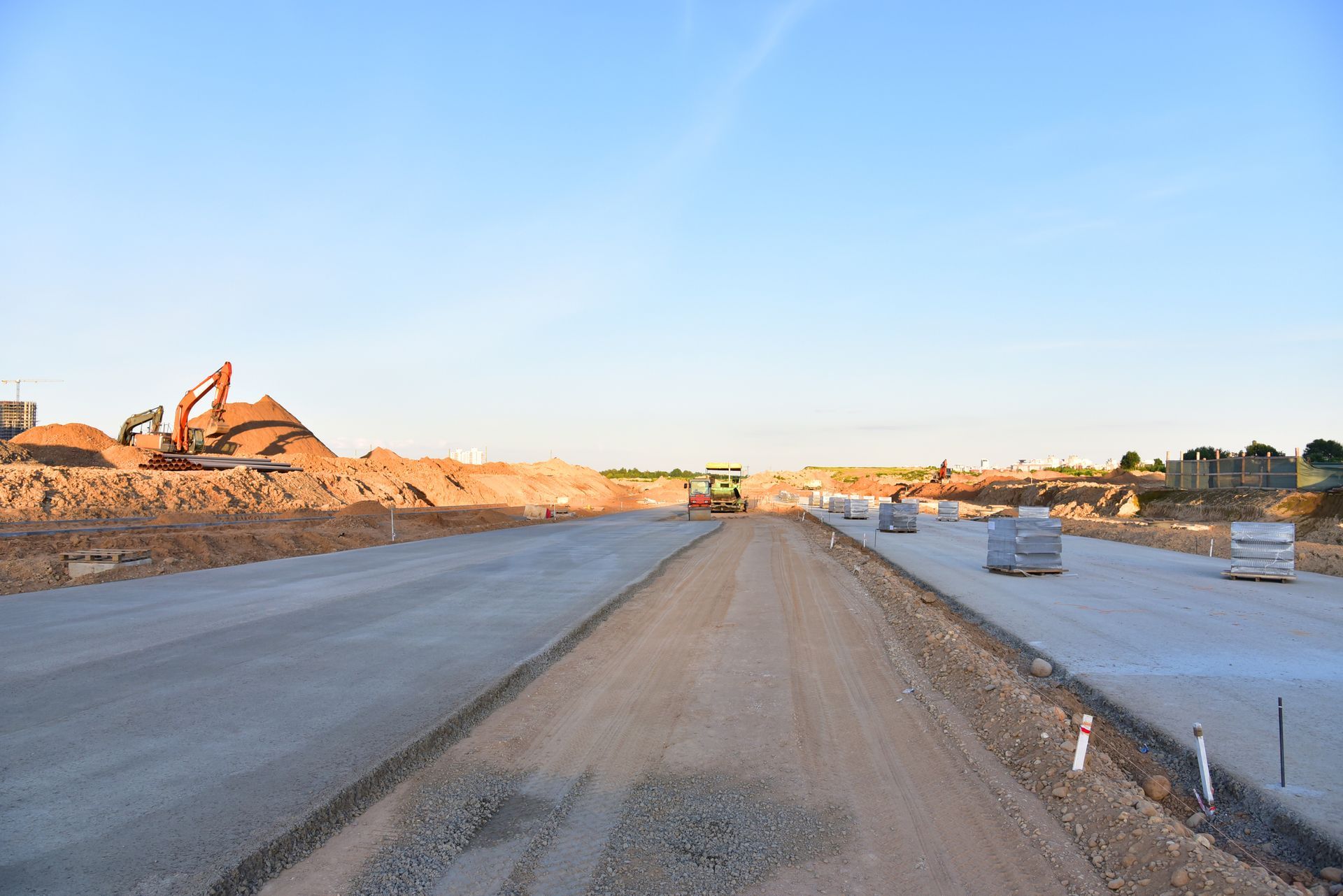 A dirt road is being built on a construction site.