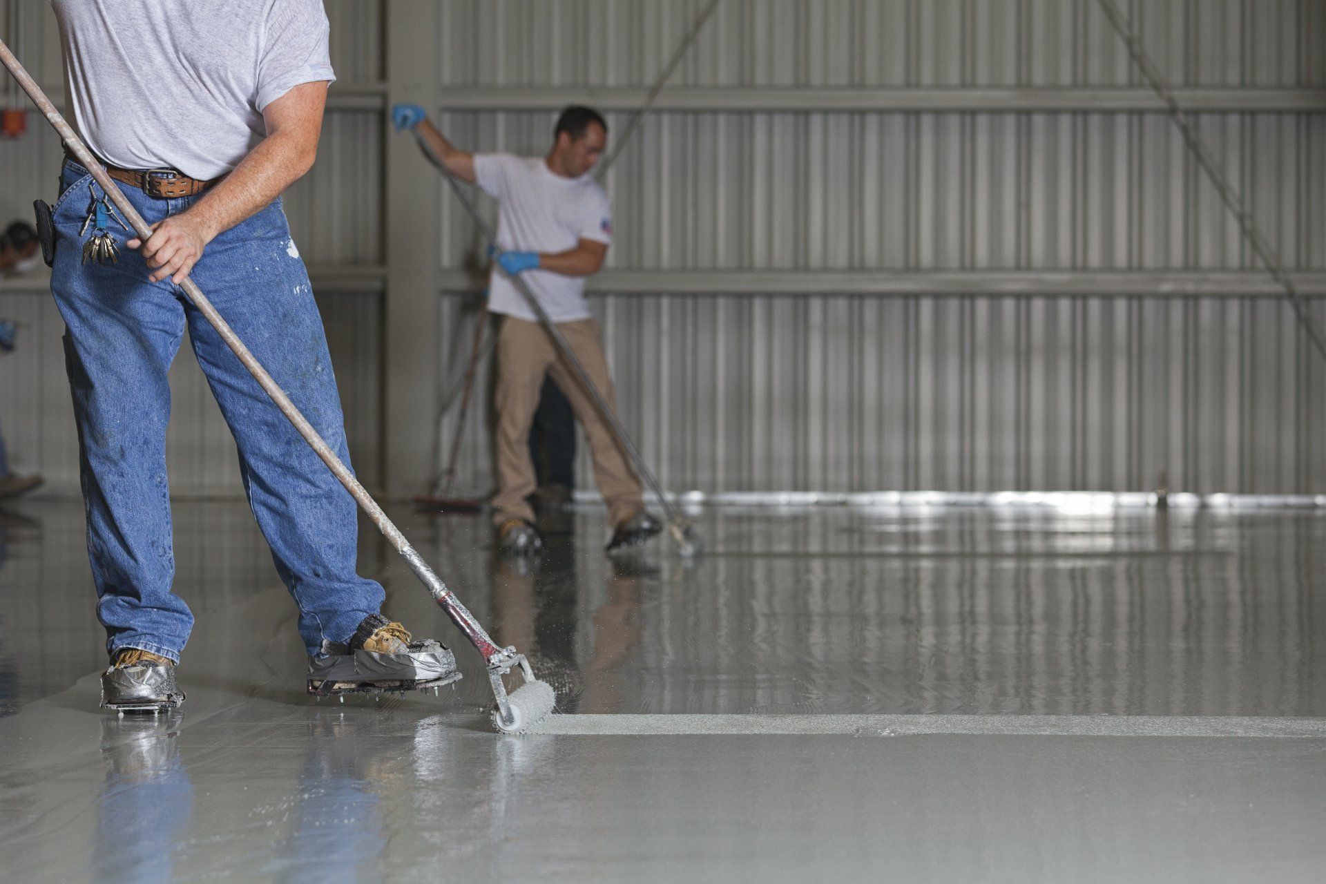 Men Coating the Floors — Richmond, VA — Epoxy Systems LLC