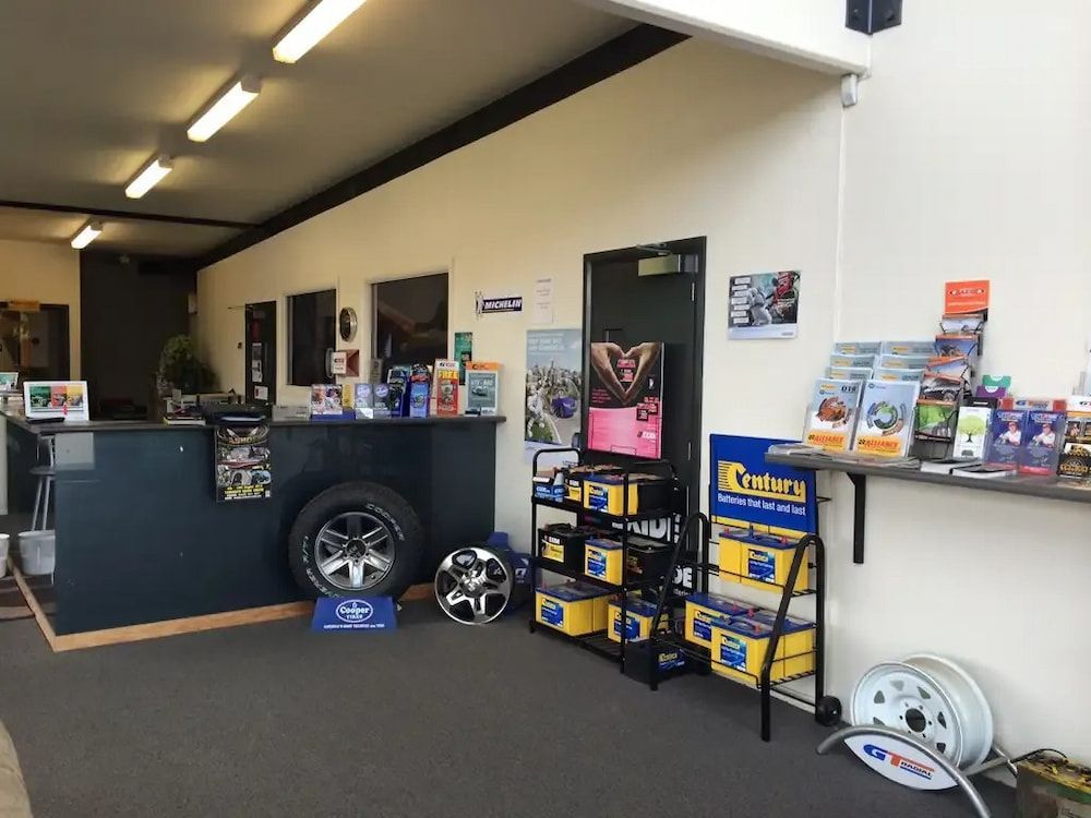 A Showroom With A Counter And A Display Of Tires And Batteries — Bones Tyres in Armidale, NSW