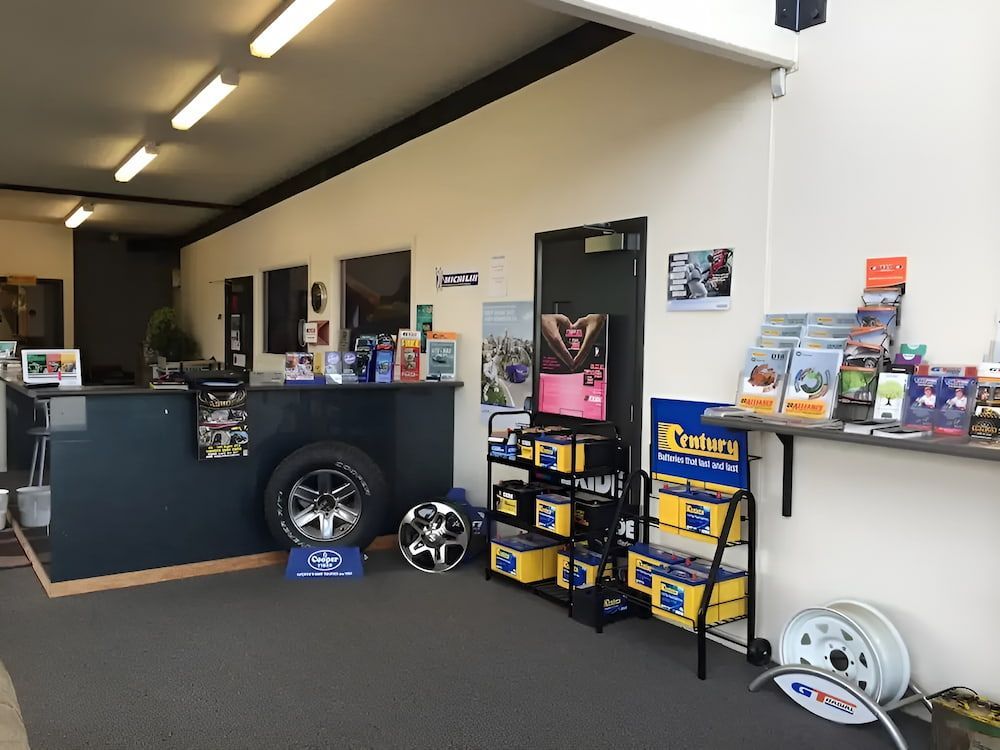 The Inside Of A Tyres Shop With A Display Of Batteries — Bones Tyres in Armidale, NSW
