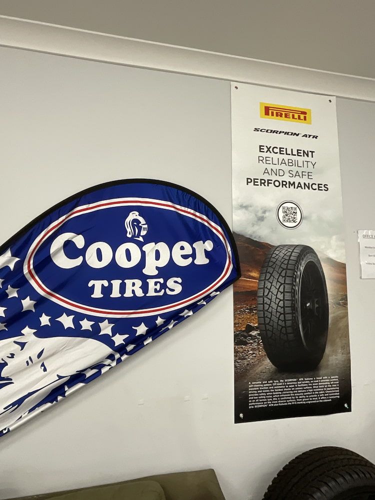 A Sign For Cooper Tires Hangs On A Wall — Bones Tyres in Armidale, NSW
