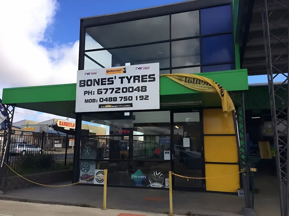 A Building With A Sign That Says Bones Tyres On It — Bones Tyres in Armidale, NSW