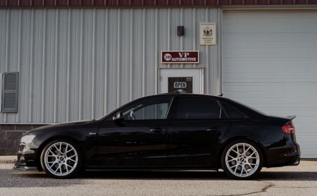 A black car parked in front of the shop | VP Automotive