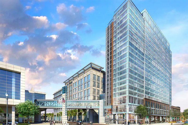 An artist 's impression of a large building in a city.