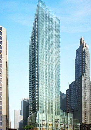 An artist 's impression of a tall building in a city