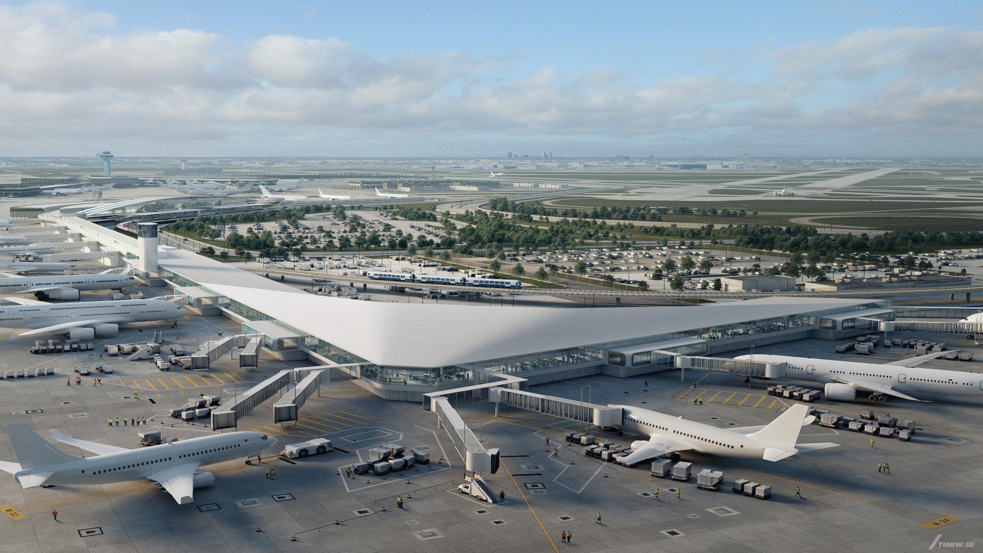 An aerial view of an airport with planes parked on the tarmac.