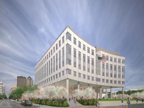 An artist 's impression of a large white building with a flag on top.