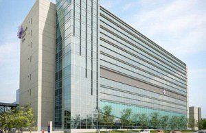 An artist 's impression of a large building with a lot of windows.