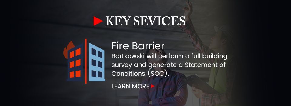 A sign that says key services fire barrier on it