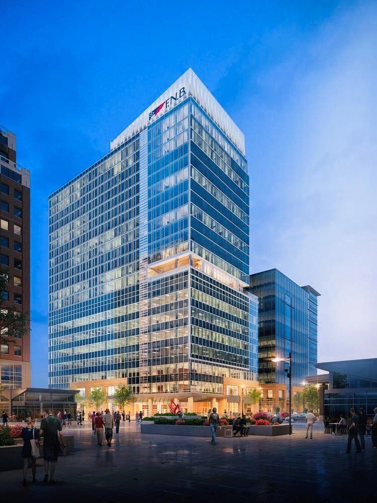 An artist 's impression of a tall building in a city at night.