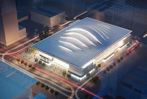 An aerial view of a large building in a city at night.