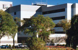 A large white building with the letter l on it