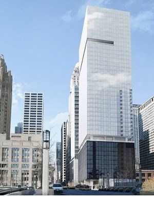 A very tall building in the middle of a city