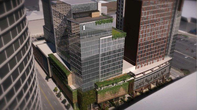 An aerial view of a city with a lot of tall buildings.