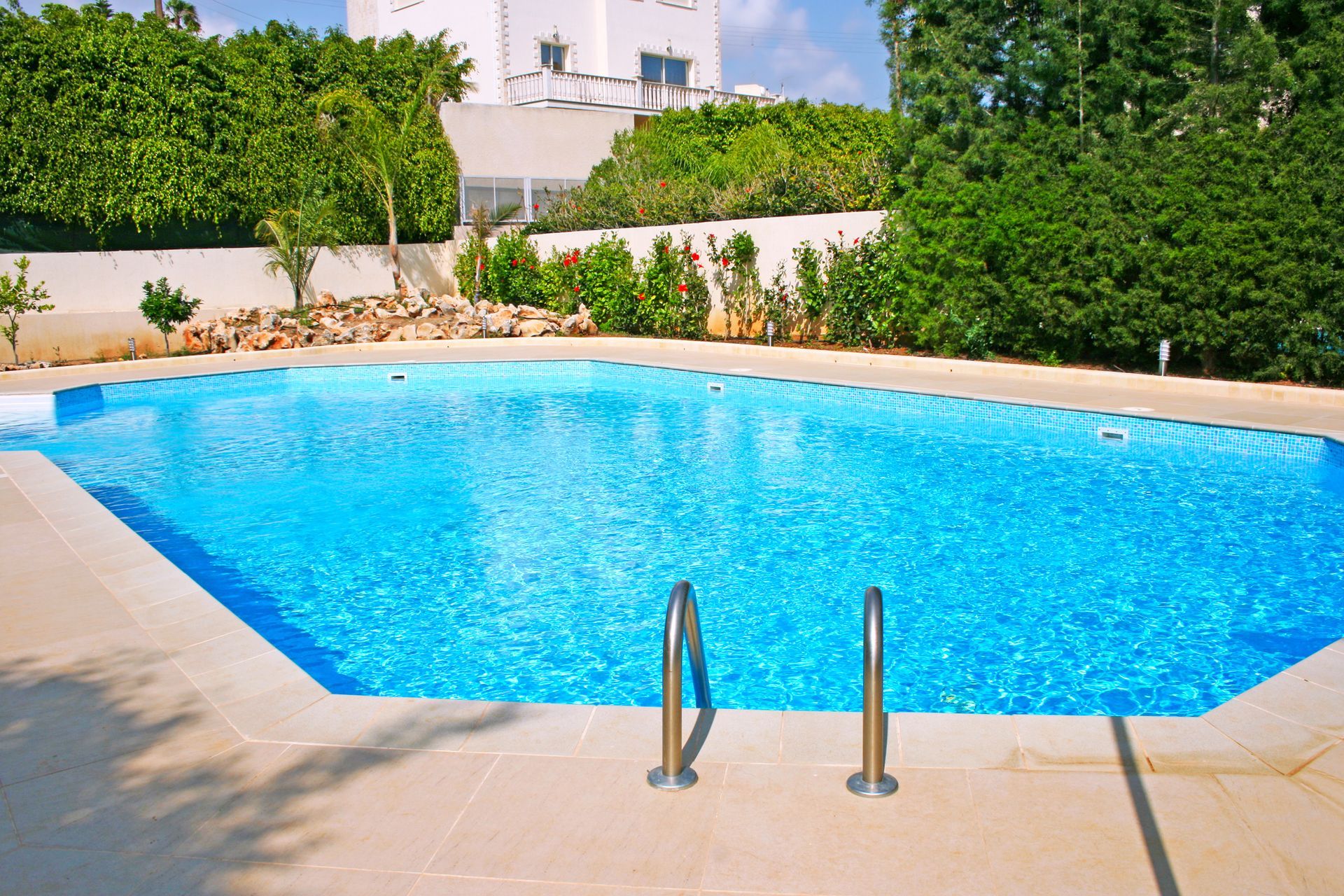 A large swimming pool showcasing custom pool construction in Auburn, IL, ideal for inground swimming