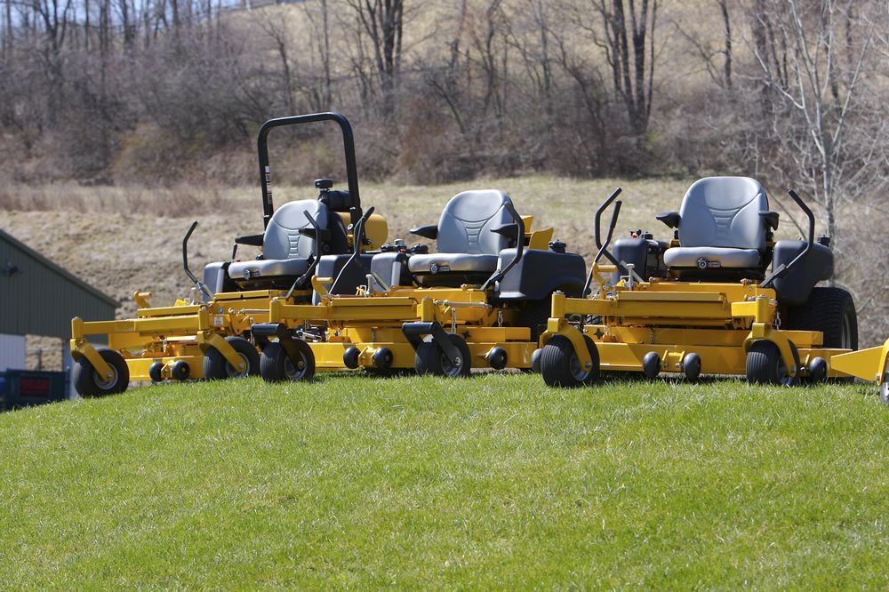 Three Zero-turn Lawn Mowers Parked On Green Grass — Stihl Shop Atherton In Atherton, QLD
